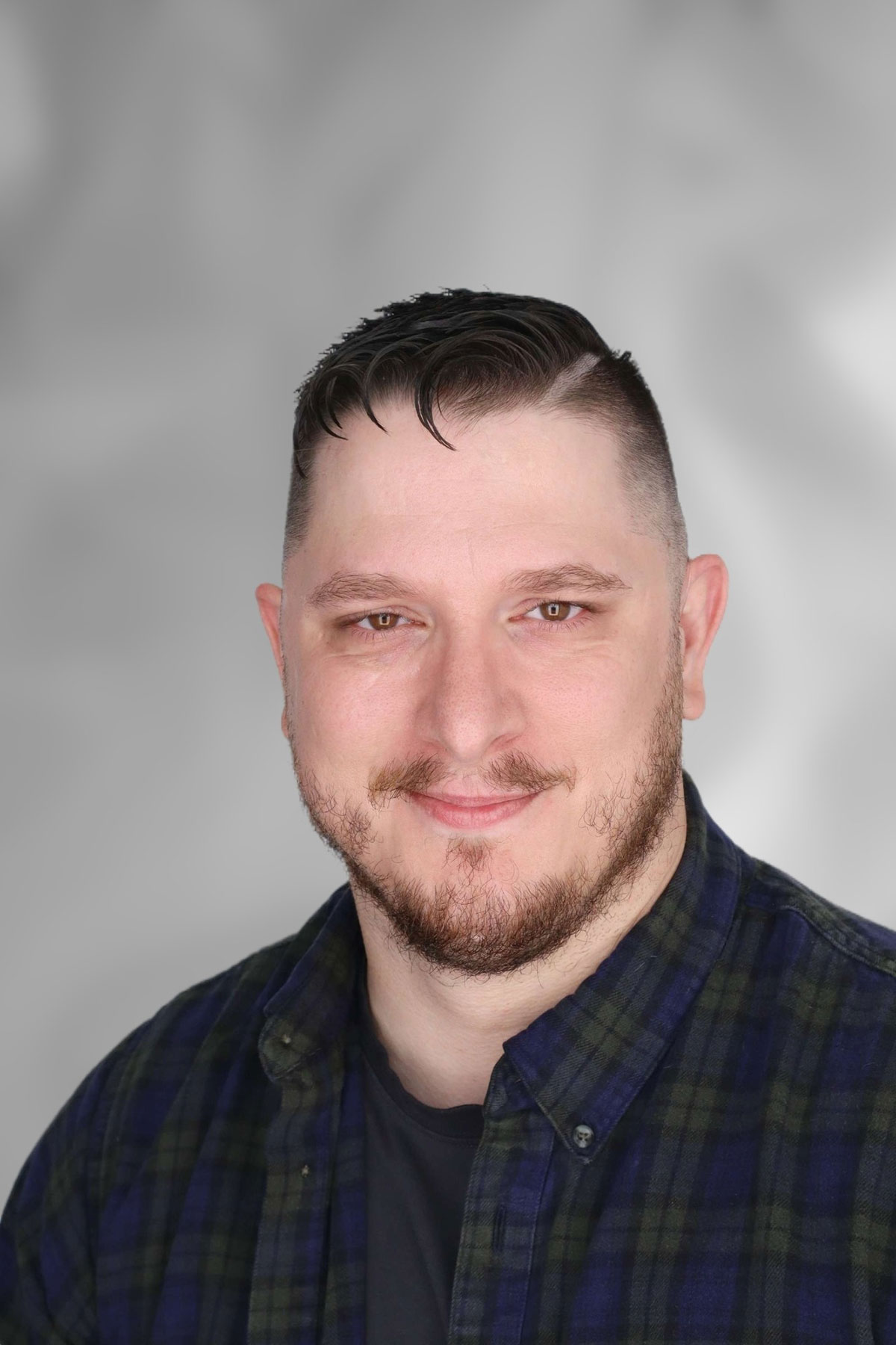 Scott Tabor, Program Assistant for Student Disability Services at the University of Arkansas - Fort Smith, smiling in a professional headshot.