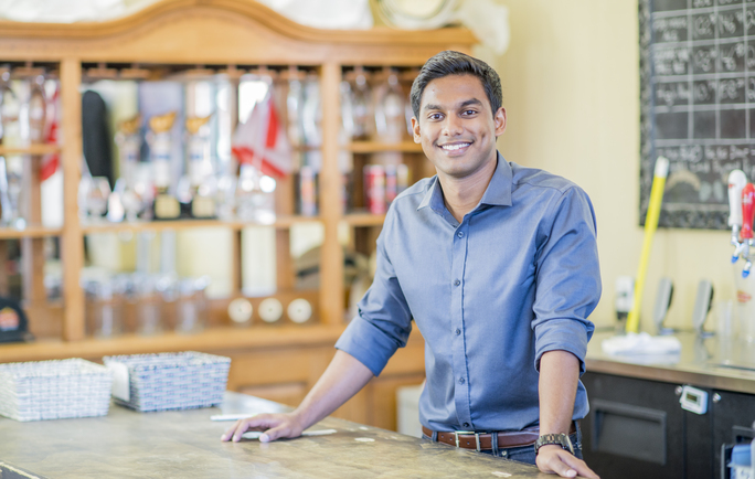 Small business owner at a counter