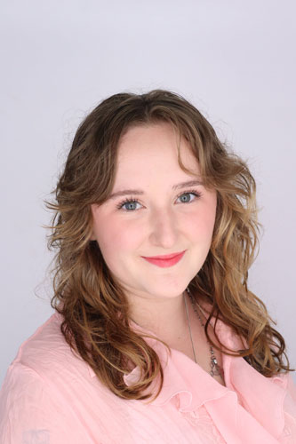 Gabbie Stokes smiles at camera