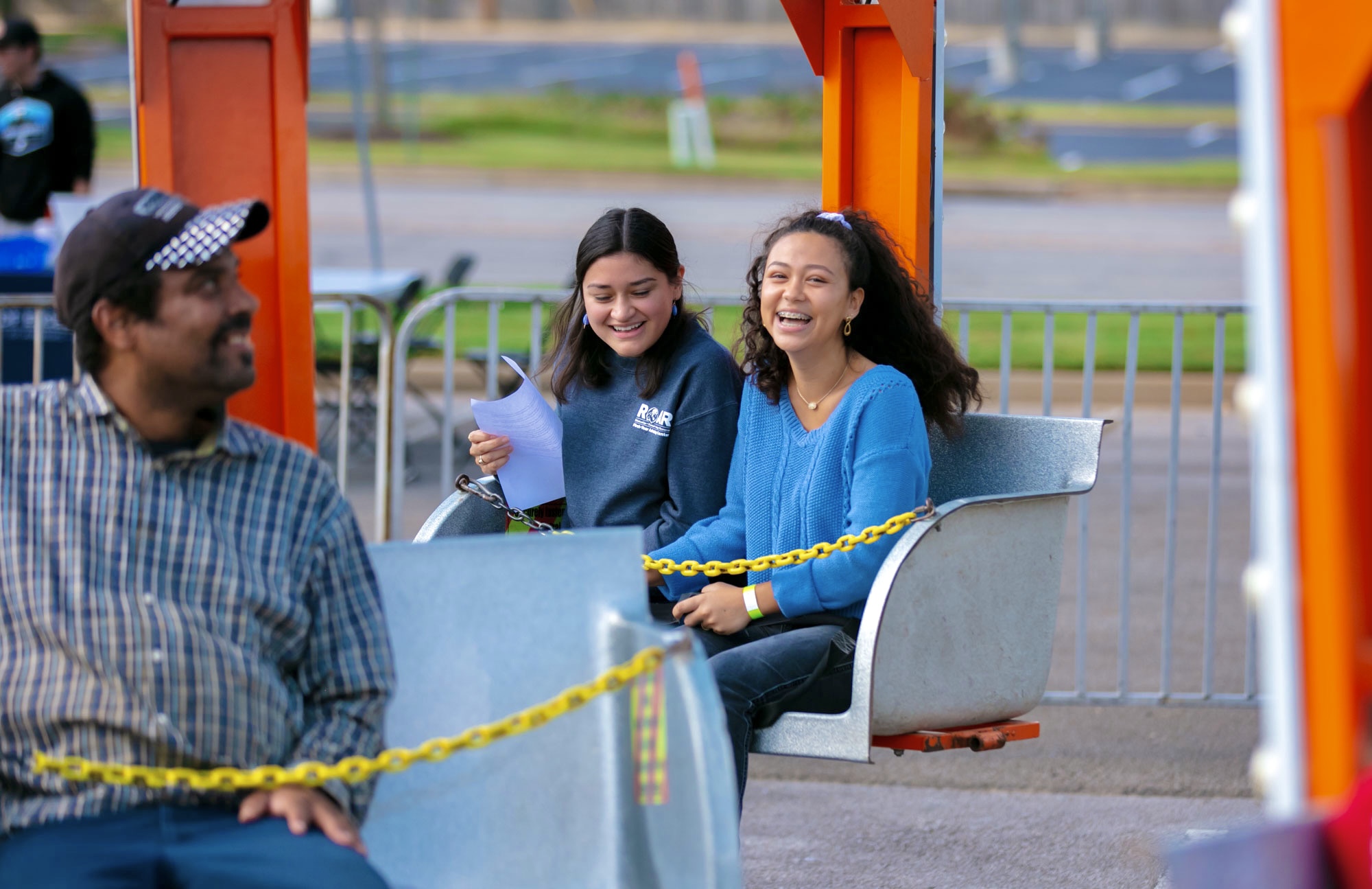 two girls on a carnival ride.
