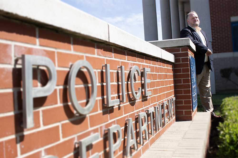 Wes Milam, a University of Arkansas - Fort Smith adjunct criminal justice professor and Fort Smith Police Captain, stands outside of the FSPD station