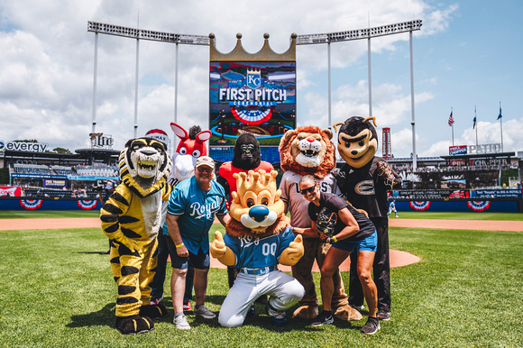 Costumed mascots of MIAA teams at the pitcher's mound