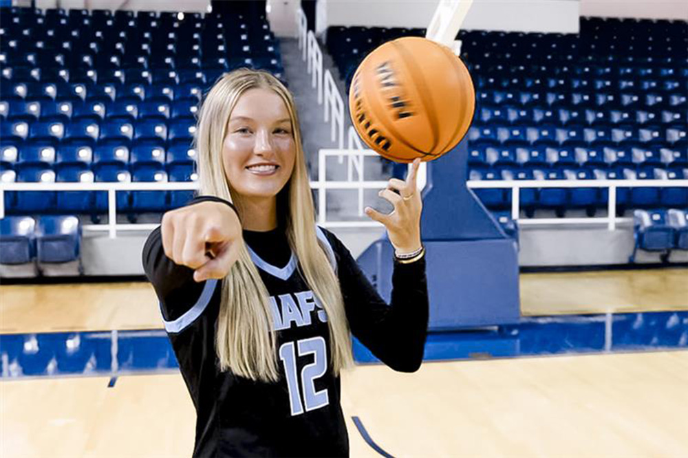 Abby Summitt spins a basketball on the court of the Stubblefield Center at UAFS
