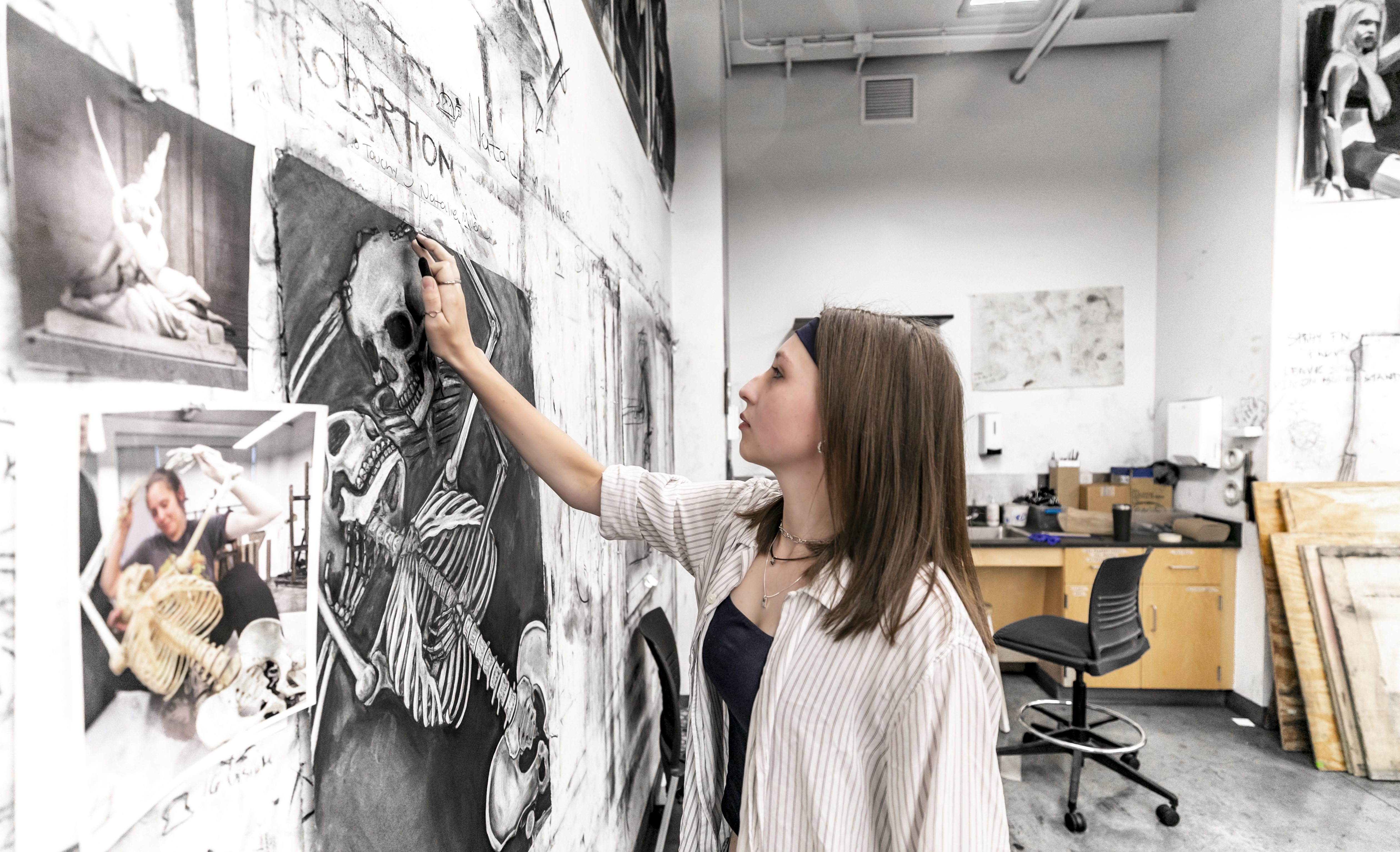 Natalie Miller puts finishing touches on her first-place anatomy drawing