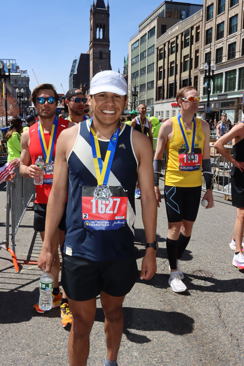 Isai Carranza poses for photo at the Boston Marathon.