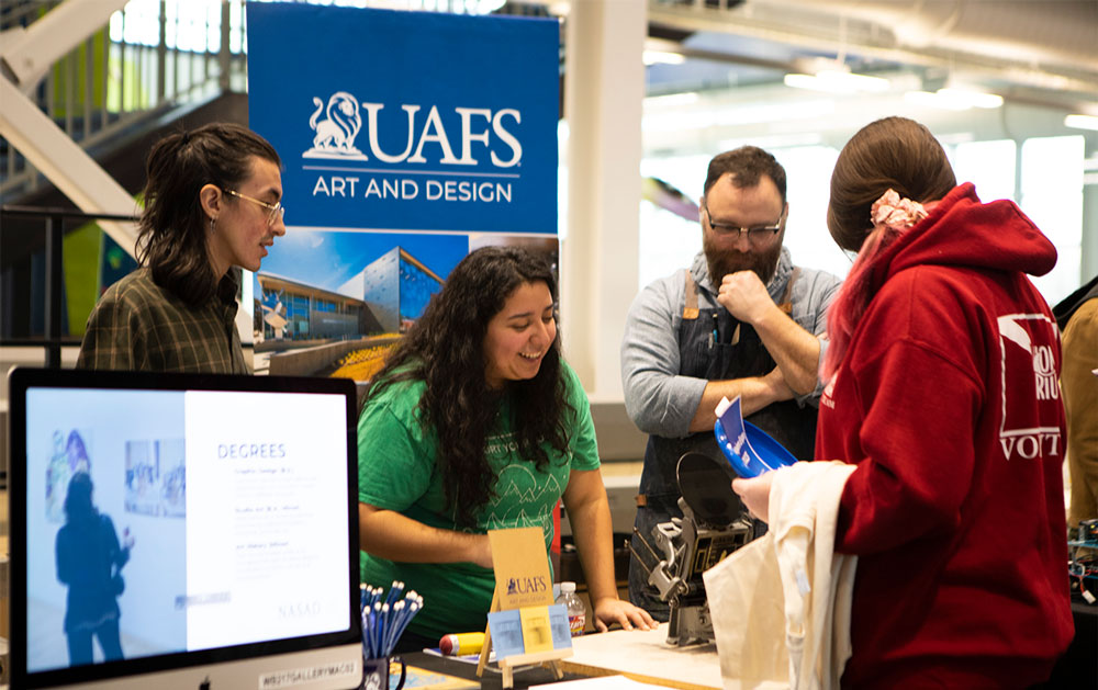 Art and Design students and faculty speak to interested students about joining the program