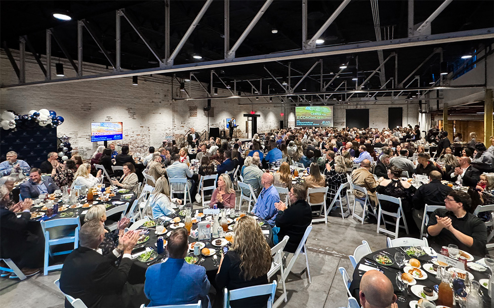 Audience members applaud during the second Center for Economic Development Excellence in Family and Small Business Awards at the Bakery District