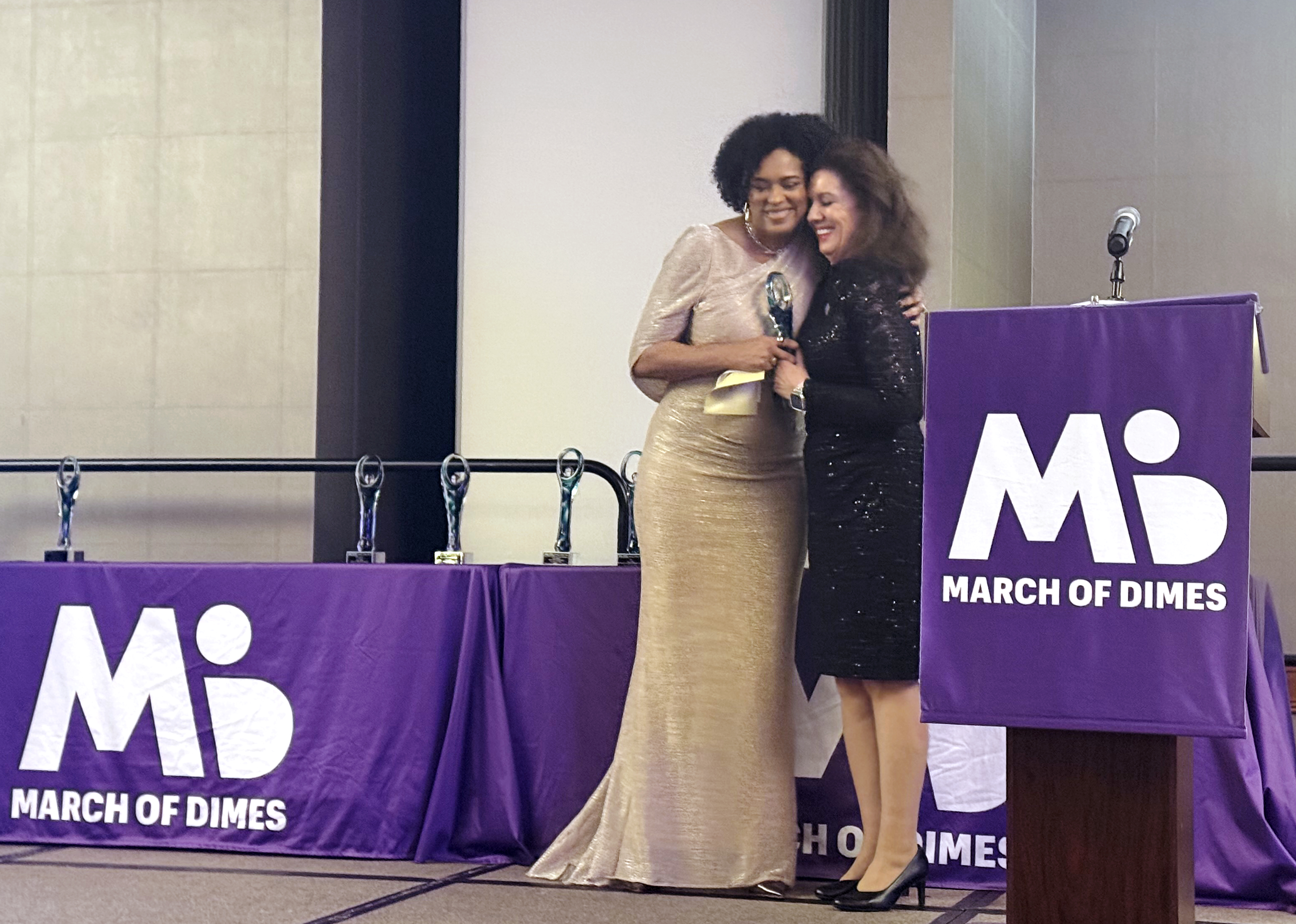 Dr. Paula Julian and Dr. Patti Conard hug as Conard accepts the Nurse of the Year in Education award Nov. 20, 2025