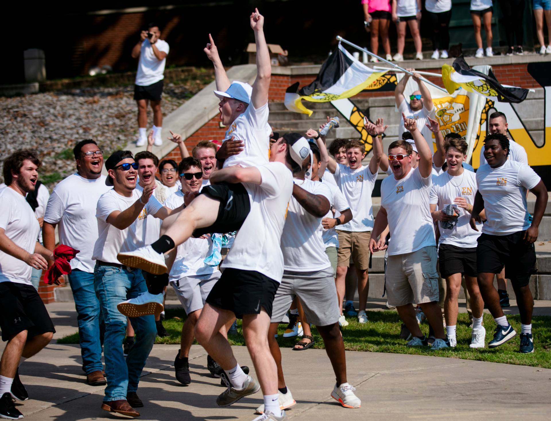 Dylan Newell runs home to his Fraternity, Sigma Nu, at the 2021 Bid Day celebration.