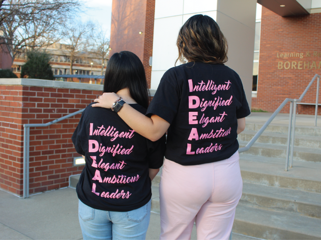 two women in shirts that say Intelligent, Dignified, Elegant, Ambitious, Leaders
