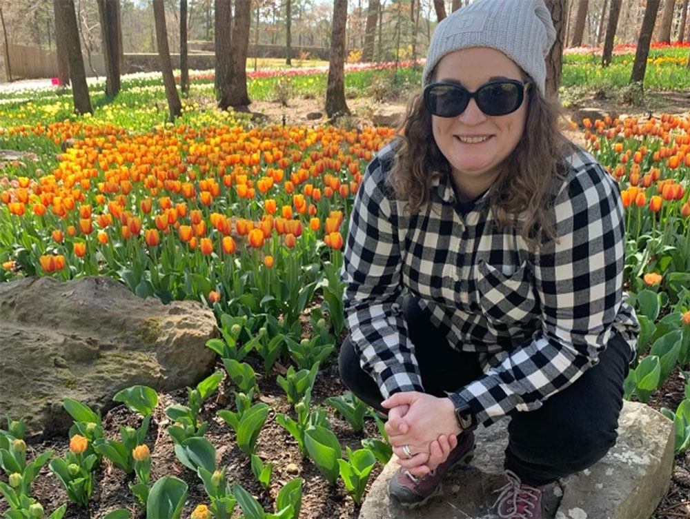 Woman sitting outside with tulips