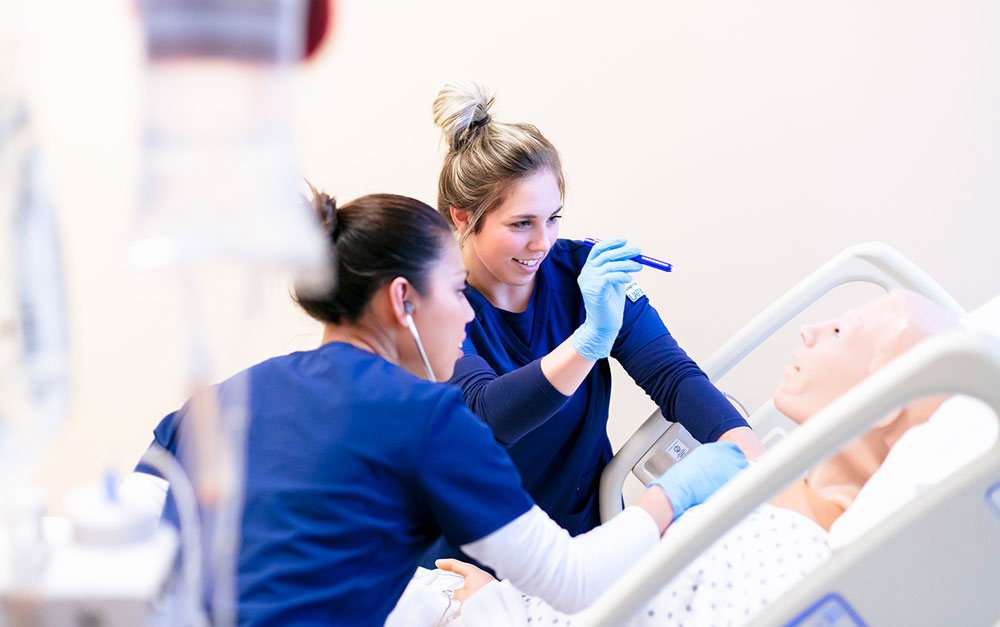 UAFS nursing students demonstrate skills learned in the classroom by examining a simulated patient