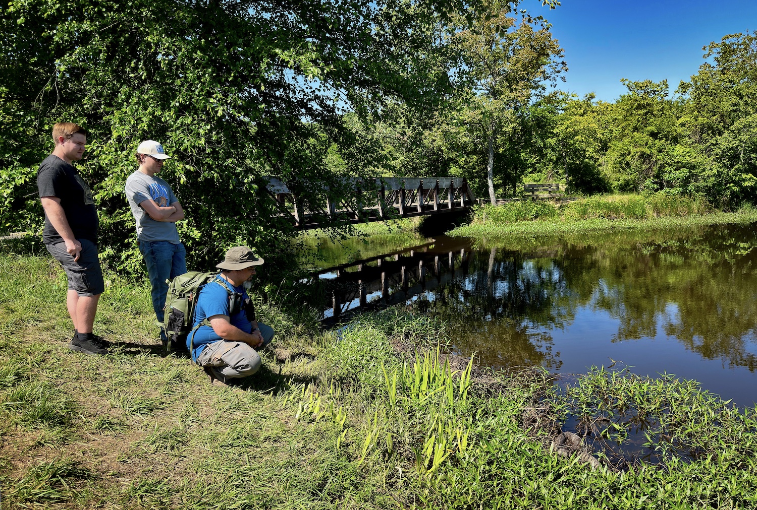 Dr. Jason Ortega points out a diamondback watersnake at Wells Lake in Fort Smith