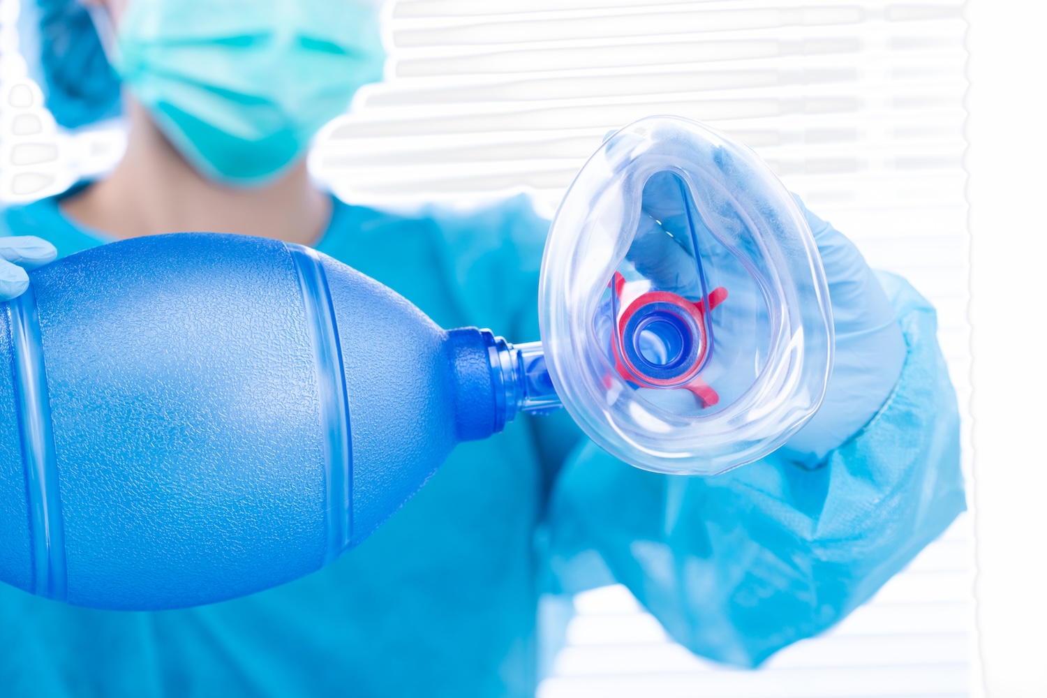a respiratory therapist holds a breathing apparatus