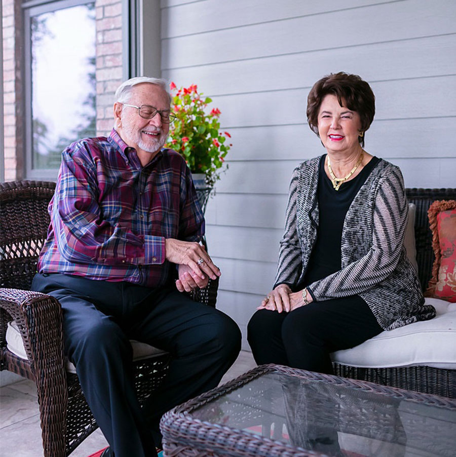 Dr. Sandi Sanders, right, sits at home with her husband, Sandy Sanders