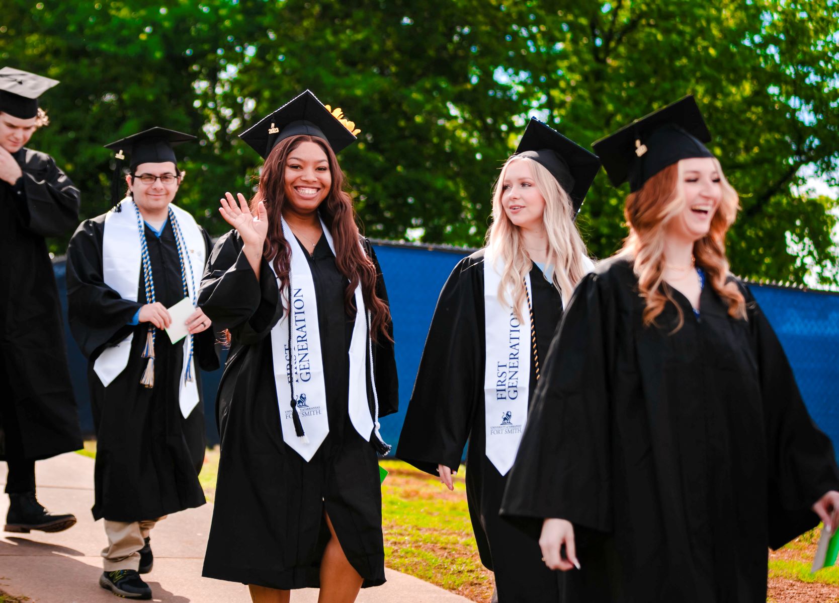 students in caps and gowns for graduation