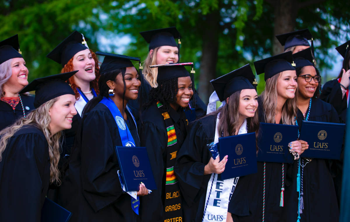 Graduates pose for a photo