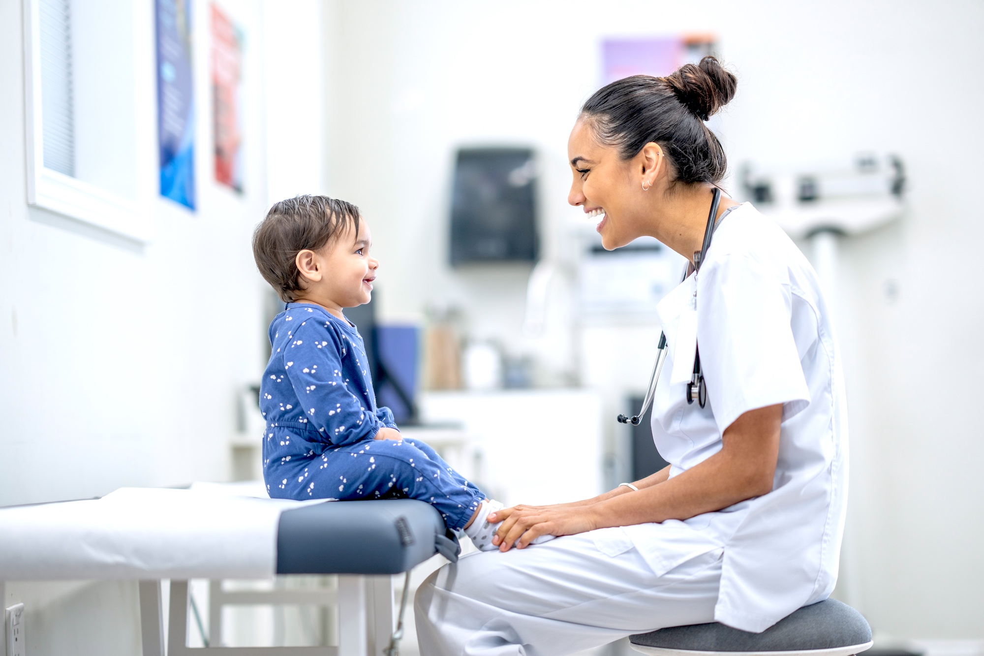 a physician speaks to a child