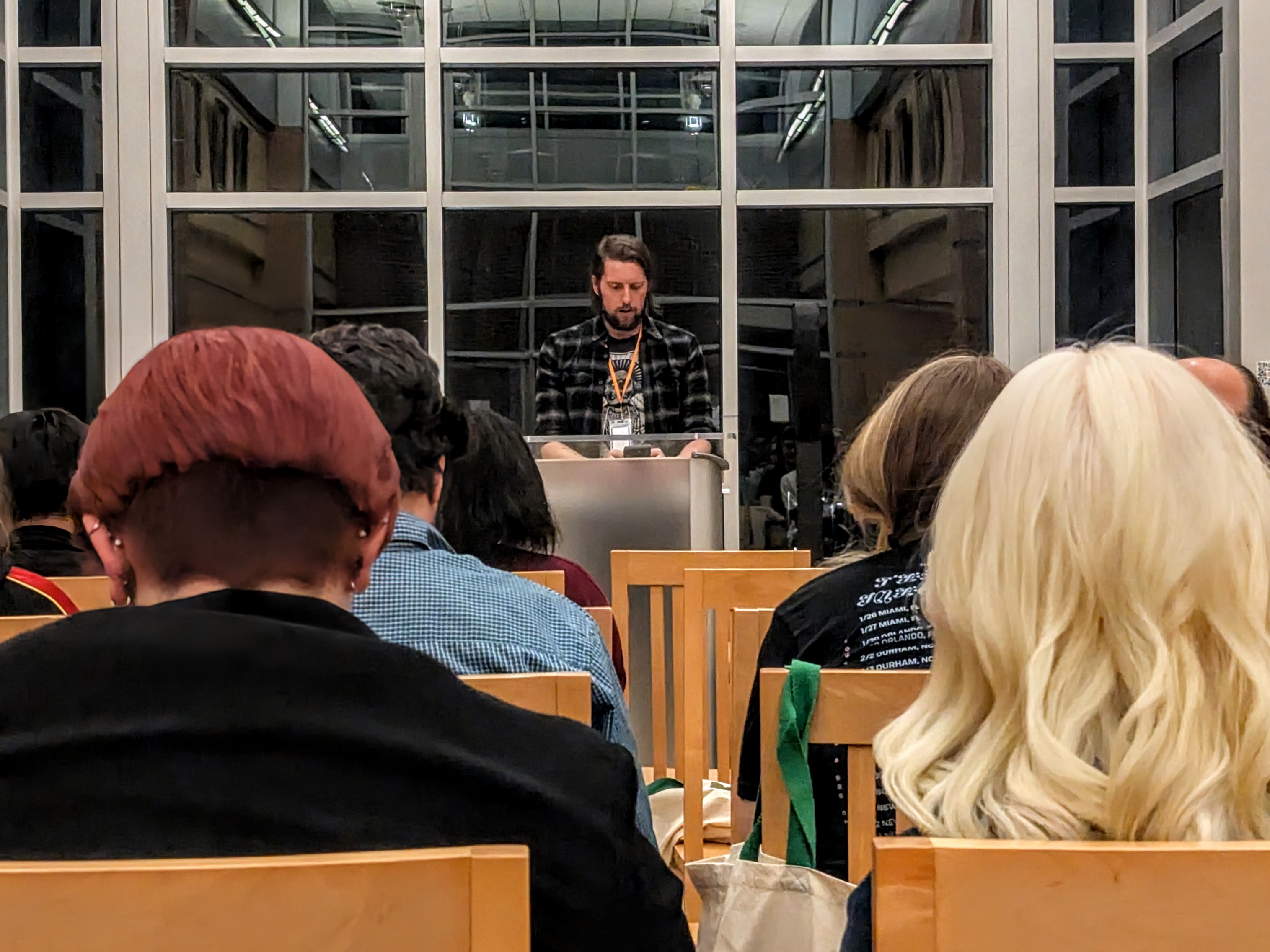 zac mathias reads from applause during the Southern Literary Festival.